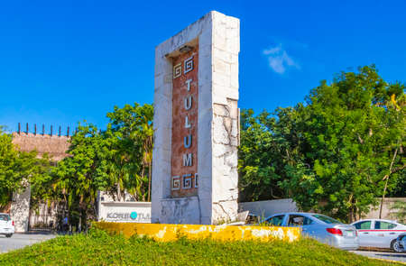 Tulum Mexico February 02, 2022 Driving thru typical colorful street road and cityscape with cars traffic palm trees bars and restaurants of Tulum in Mexico.のeditorial素材