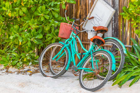 Tulum Mexico February 02, 2022 Turquoise bikes bicycles at the amazing and beautiful caribbean coast and beach panorama view with turquoise water people and huts of Tulum in Quintana Roo Mexico.のeditorial素材