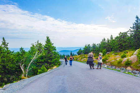 Lower Saxony Germany August 17, 2013 Forest with fir trees landscape panorama tourists and walking trekking path at Brocken mountain peak in Harz mountains Wernigerode Saxony-Anhalt Germanyのeditorial素材