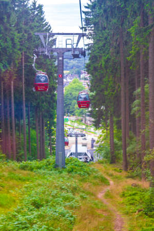Harz Germany August 18, 2013 Wurmberg ride with the red gondola cable car railway with panorama view to mountain landscape of Braunlage Harz Goslar in Lower Saxony Germany.のeditorial素材
