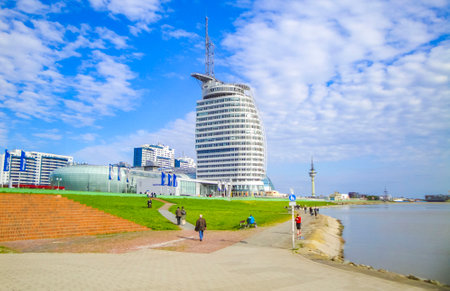 Bremerhaven Germany May 02, 2010 Cityscape and coast panorama of ATLANTIC Hotel Sail City lighthouse architecture ships boats dike and landscape of Bremerhaven in Germany.のeditorial素材