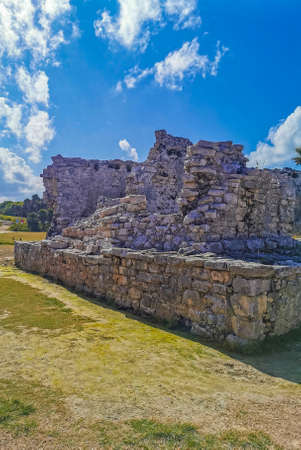 Ancient Tulum ruins Mayan site with temple ruins pyramids and artifacts in the tropical natural...