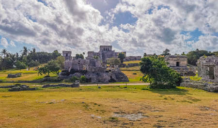 Tulum Mexico February 24, 2022 Ancient Tulum ruins Mayan site with temple ruins pyramids and artifacts in the tropical natural jungle forest palm and seascape panorama view in Tulum Mexico.のeditorial素材