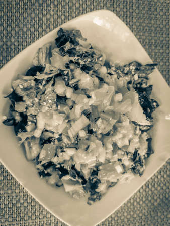 Old black and white picture of Plate of healthy salad food and drink in the restaurant PapaCharly...