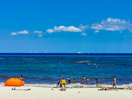 Playa del Carmen May 14, 2022 Tropical mexican beach with Sargazo seaweed net and clear turquoise blue water in Playa del Carmen Mexico with panorama view to Cozumel island..のeditorial素材