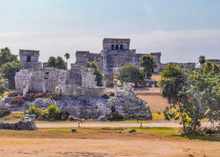Tulum Mexico April 09, 2022 Ancient Tulum ruins Mayan site with temple ruins pyramids and artifacts in the tropical natural jungle forest palm and seascape panorama view in Tulum Mexico.のeditorial素材