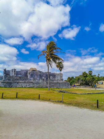 Tulum Mexico April 11, 2022 Ancient Tulum ruins Mayan site with temple ruins pyramids and artifacts in the tropical natural jungle forest palm and seascape panorama view in Tulum Mexico.のeditorial素材