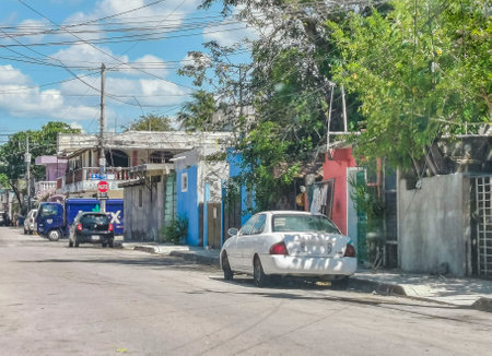 Playa del Carmen Mexico May 16, 2022 Typical street road and cityscape with cars and buildings of Playa del Carmen in Quintana Roo Mexico.のeditorial素材