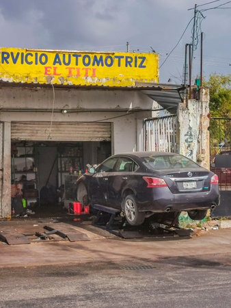 Playa del Carmen Mexico May 23, 2022 Typical street road and cityscape with cars and buildings of Playa del Carmen in Quintana Roo Mexico.のeditorial素材