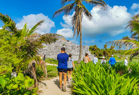 Tulum Mexico June 22, 2022 Ancient Tulum ruins Mayan site with temple ruins pyramids and artifacts in the tropical natural jungle forest palm and seascape panorama view in Tulum Mexico.のeditorial素材