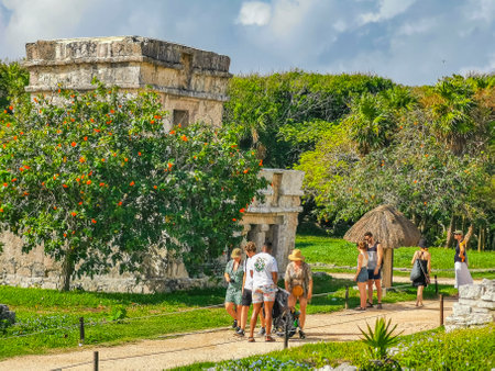 Tulum Mexico June 22, 2022 Ancient Tulum ruins Mayan site with temple ruins pyramids and artifacts in the tropical natural jungle forest palm and seascape panorama view in Tulum Mexico.のeditorial素材