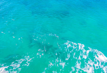 Beautiful blue and turquoise water waves ocean and sea texture pattern of Contoy island in Cancun Quintana Roo Mexico.の写真素材