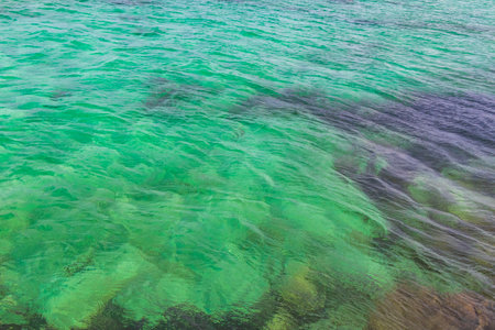 Beautiful blue and turquoise water waves ocean and sea texture pattern of Playa del Carmen in Quintana Roo Mexico.の写真素材