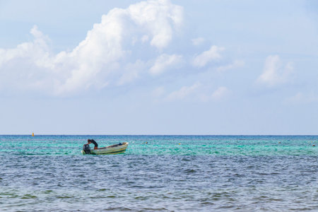 Boat yacht ship ferry jetty pier and harbor at the tropical mexican beach panorama view from Playa 88 and Punta Esmeralda in Playa del Carmen Mexico.の写真素材
