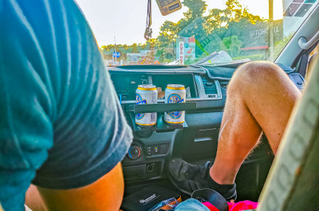 Playa del Carmen Mexico February 25, 2022 Driving in the car thru typical street road and cityscape...