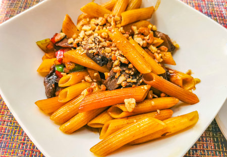White plate of Thai pasta noodles meal dish food and drink in the restaurant PapaCharly Papa Charly in Playa del Carmen Quintana Roo Mexico.の写真素材