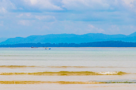 Naiyang Beach bay and landscape panorama a beautiful dream beach with turquoise clear water and waves in Sakhu Thalang on Phuket island Thailand in Southeastasia Asia.の写真素材