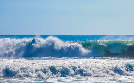 Extremely huge big surfer waves on the beach in Zicatela Puerto Escondido Oaxaca Mexico.の写真素材