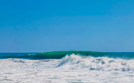 Extremely huge big surfer waves on the beach in Zicatela Puerto Escondido Oaxaca Mexico.