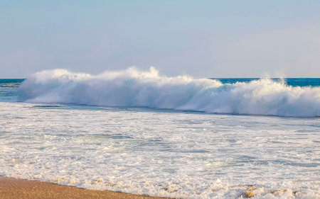 Extremely huge big surfer waves on the beach in Zicatela Puerto Escondido Oaxaca Mexico.