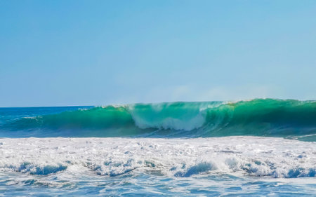 Extremely huge big surfer waves on the beach in Zicatela Puerto Escondido Oaxaca Mexico.の写真素材