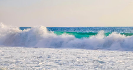 Extremely huge big surfer waves on the beach in Zicatela Puerto Escondido Oaxaca Mexico.