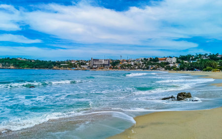 Extremely beautiful huge big surfer waves on the beach in Zicatela Puerto Escondido Oaxaca Mexico.