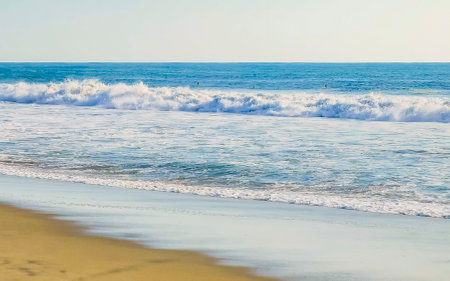 Extremely beautiful huge big surfer waves on the beach in Zicatela Puerto Escondido Oaxaca Mexico.