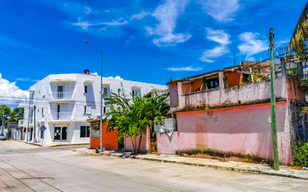 Typical street road and cityscape with cars traffic restaurants shops stores people and buildings of Playa del Carmen in Quintana Roo Mexico.のeditorial素材