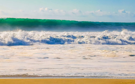 Extremely huge big surfer waves on the beach in Zicatela Puerto Escondido Oaxaca Mexico.