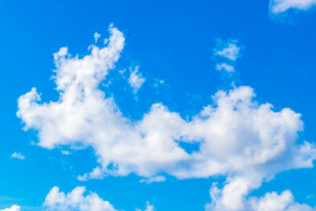 Blue sky with beautiful clouds cloud formations on sunny day in Playa del Carmen Mexico.の写真素材