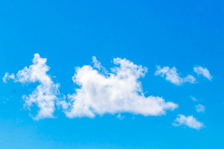 Blue sky with beautiful clouds cloud formations on sunny day in Playa del Carmen Mexico.の写真素材
