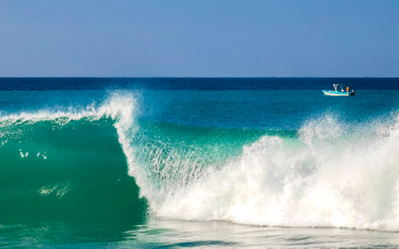 Extremely huge big surfer waves on the beach in Zicatela Puerto Escondido Oaxaca Mexico.の写真素材