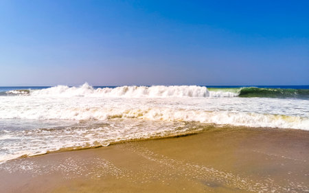 Extremely huge big surfer waves on the beach in Zicatela Puerto Escondido Oaxaca Mexico.