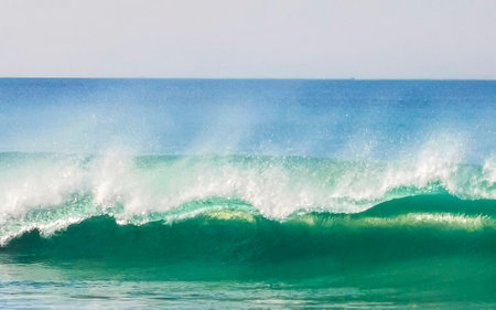 Extremely huge big surfer waves on the beach in Zicatela Puerto Escondido Oaxaca Mexico.の写真素材