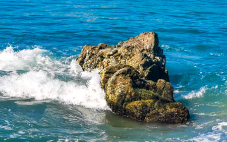 Extremely beautiful huge big surfer waves and rocks on the beach in Zicatela Puerto Escondido Oaxaca Mexico.の写真素材