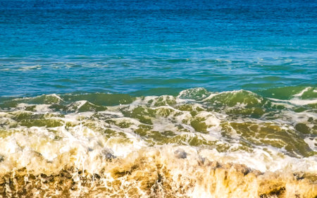 Extremely huge big surfer waves on the beach in Zicatela Puerto Escondido Oaxaca Mexico.