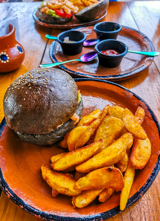 Fast food in the restaurant hamburger and fries in Playa del Carmen Quintana Roo Mexico.の写真素材