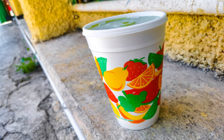 Green healthy juice smoothie in to go cup in Playa del Carmen Quintana Roo Mexico.