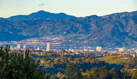 Beautiful mountain landscape and city panorama with forest trees clouds and nature of San JosÃ©...