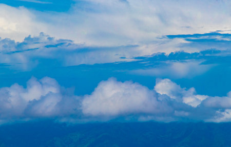 Beautiful mountain landscape and city panorama with forest trees clouds and nature of San JosÃ© and Heredia Costa Rica in Central America.の写真素材