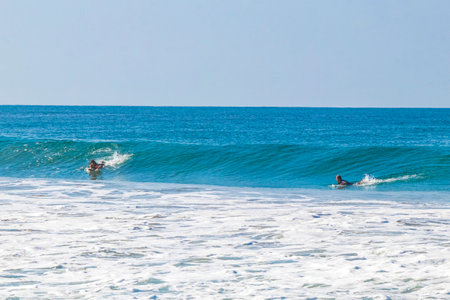 Puerto Escondido Oaxaca Mexico 2022 Surfer surfing on surfboard on high waves in Zicatela Puerto Escondido Oaxaca Mexico.の写真素材