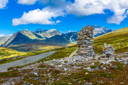 Beautiful mountain and landscape panorama with untouched nature trekking path trail and stacked...