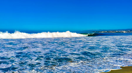 Extremely huge big surfer waves on the beach in Zicatela Puerto Escondido Oaxaca Mexico.の写真素材