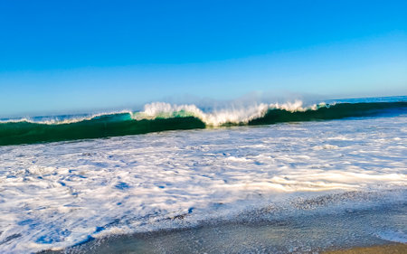 Extremely huge big surfer waves on the beach in Zicatela Puerto Escondido Oaxaca Mexico.