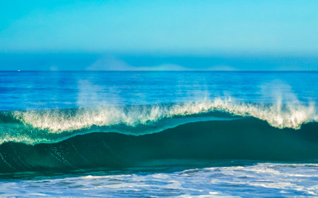 Extremely huge big surfer waves on the beach in Zicatela Puerto Escondido Oaxaca Mexico.