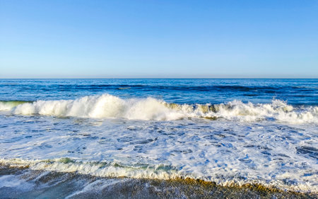 Extremely huge big surfer waves on the beach in Zicatela Puerto Escondido Oaxaca Mexico.