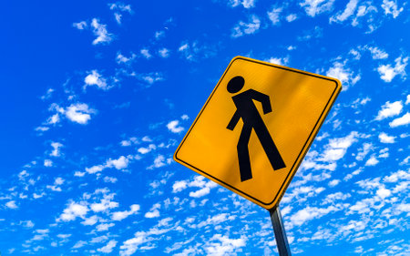 Yellow pedestrian sign street sign in Zicatela Puerto Escondido Oaxaca Mexico.の写真素材