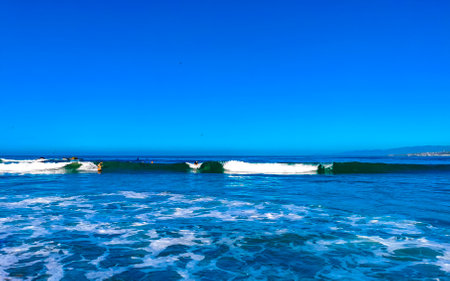 Extremely huge big surfer waves on the beach in Zicatela Puerto Escondido Oaxaca Mexico.の写真素材