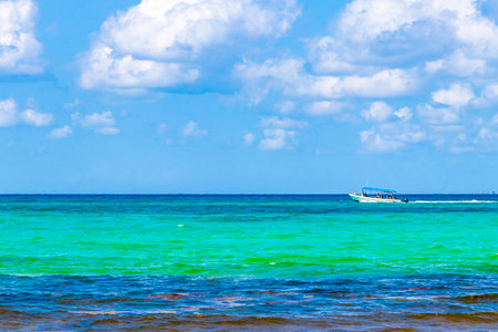 Boat yacht ship ferry jetty pier and harbor at the tropical mexican beach panorama view from Playa 88 and Punta Esmeralda in Playa del Carmen Quintana Roo Mexico.の写真素材